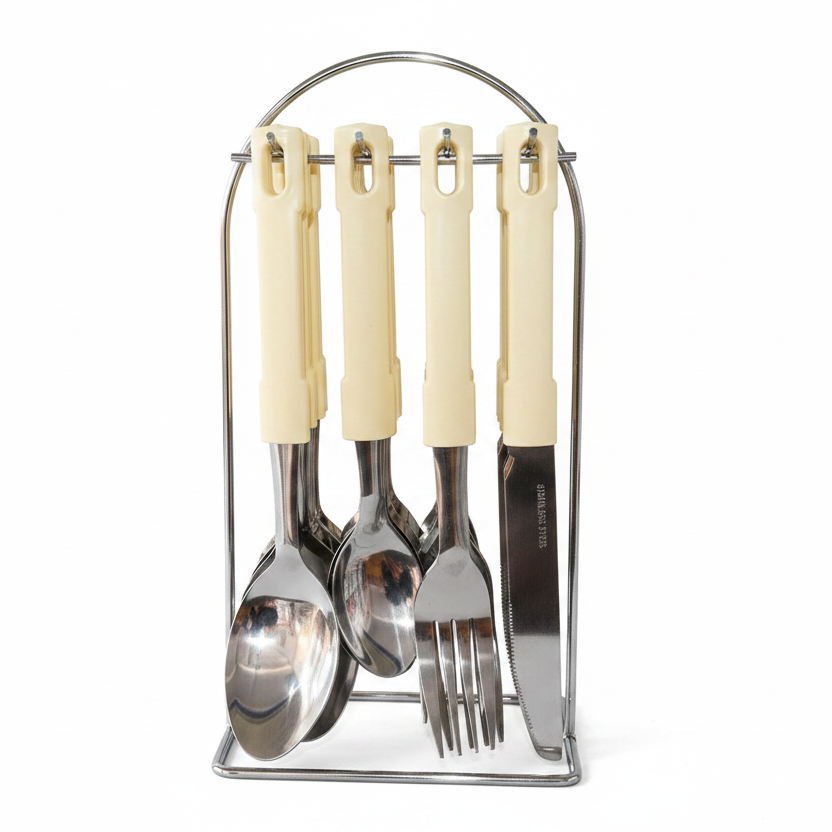 Set of cream-handled cutlery including a spoon, fork, and knife in a metal stand on a white background.