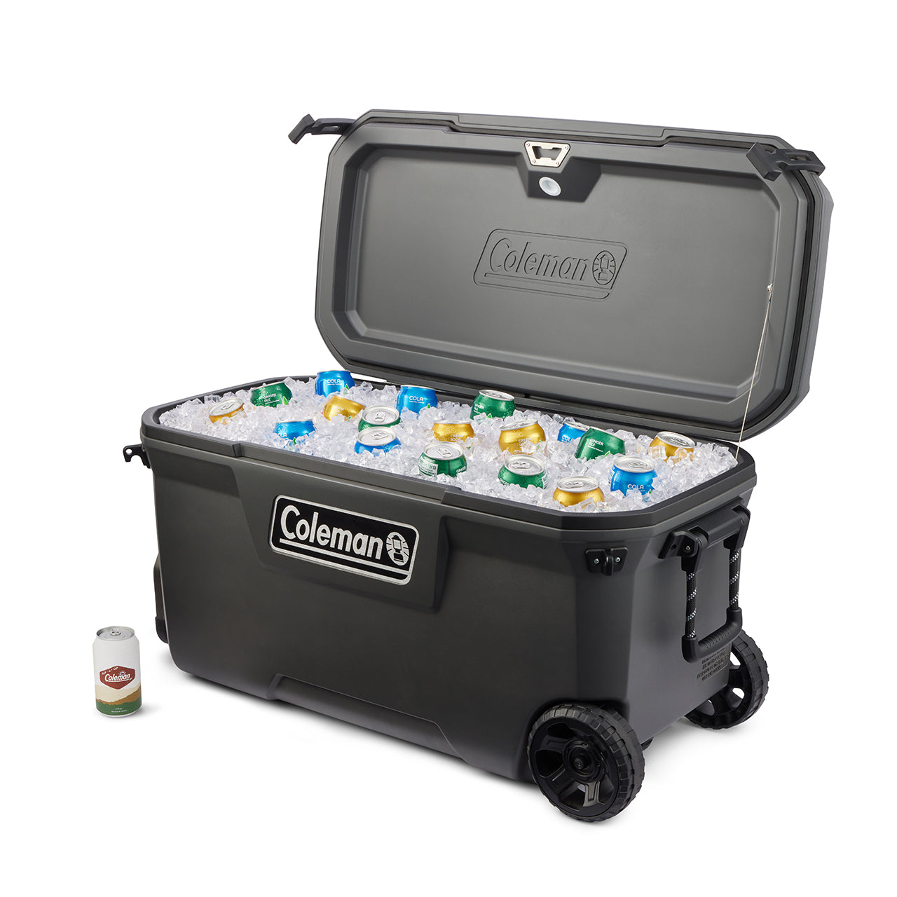 Black Coleman cooler with wheels filled with ice and bottles on a white background